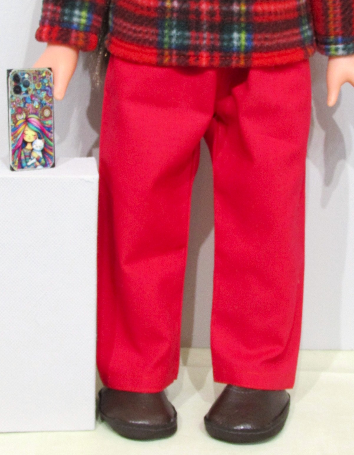 837    Tartan Fleece Top, Hat, Red Jeans, Shoes and mobile phone