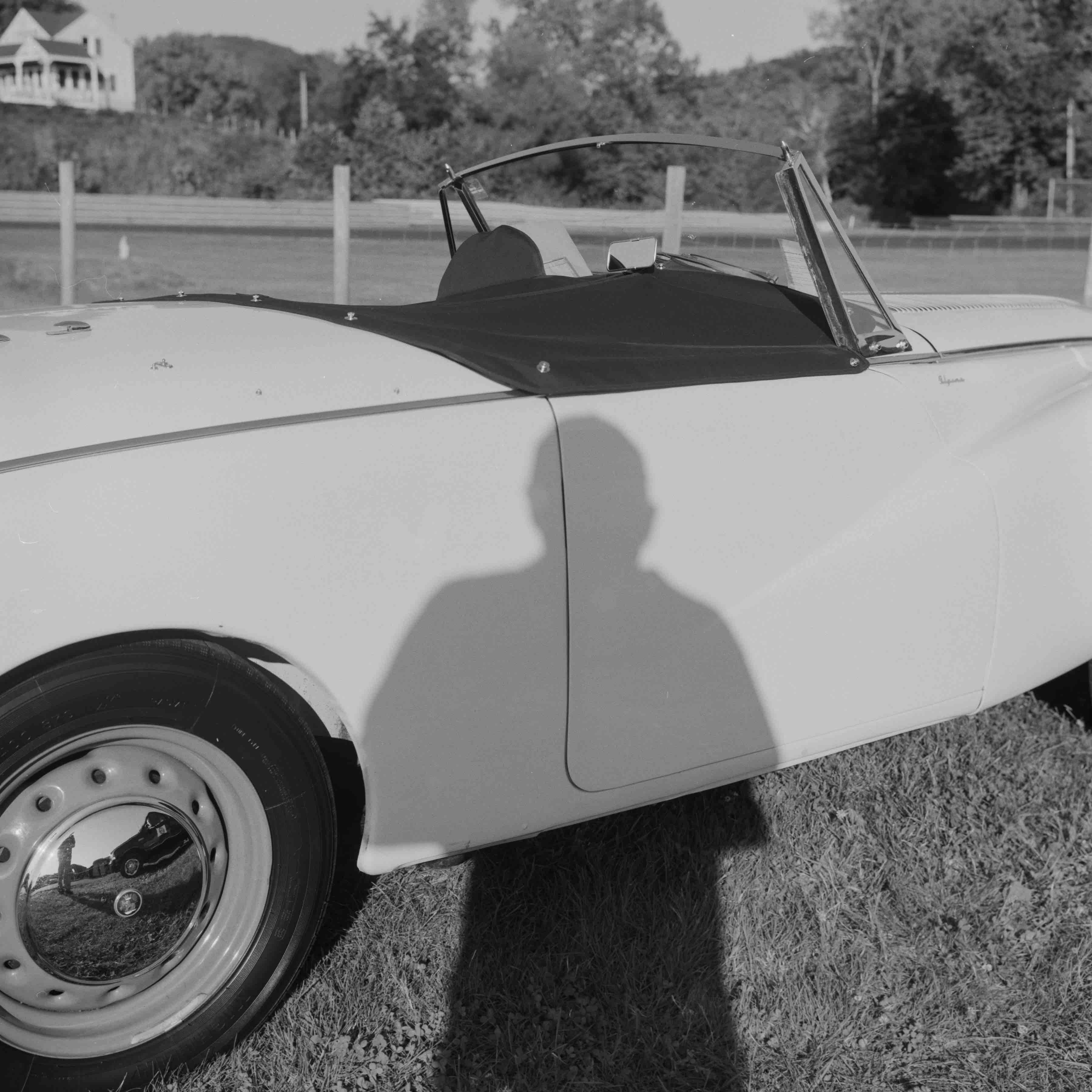 Autoportrait with 1954 Sunbeam Alpine, LRP, undated