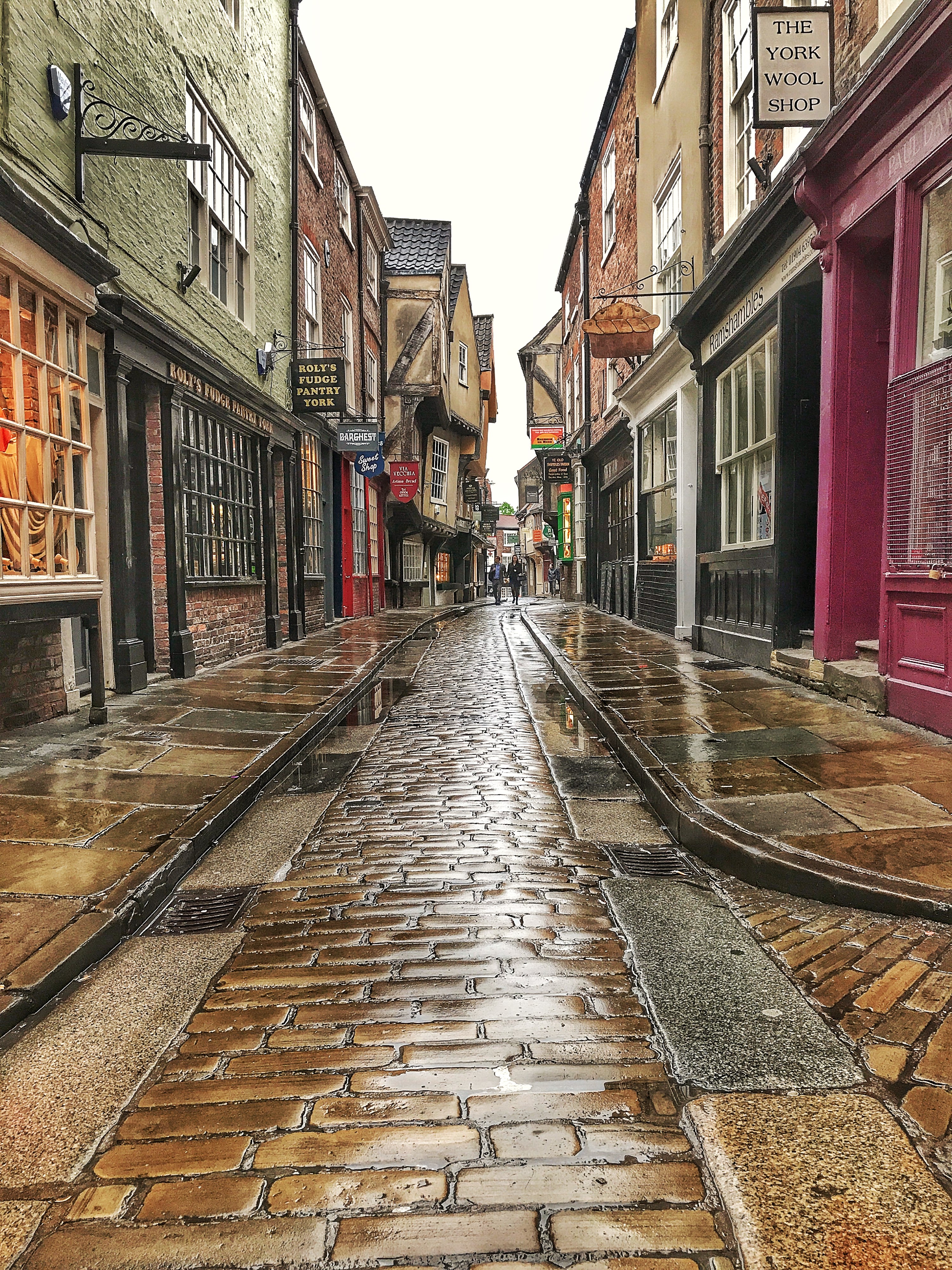 Couple Walking Through Shambles In The Rain 