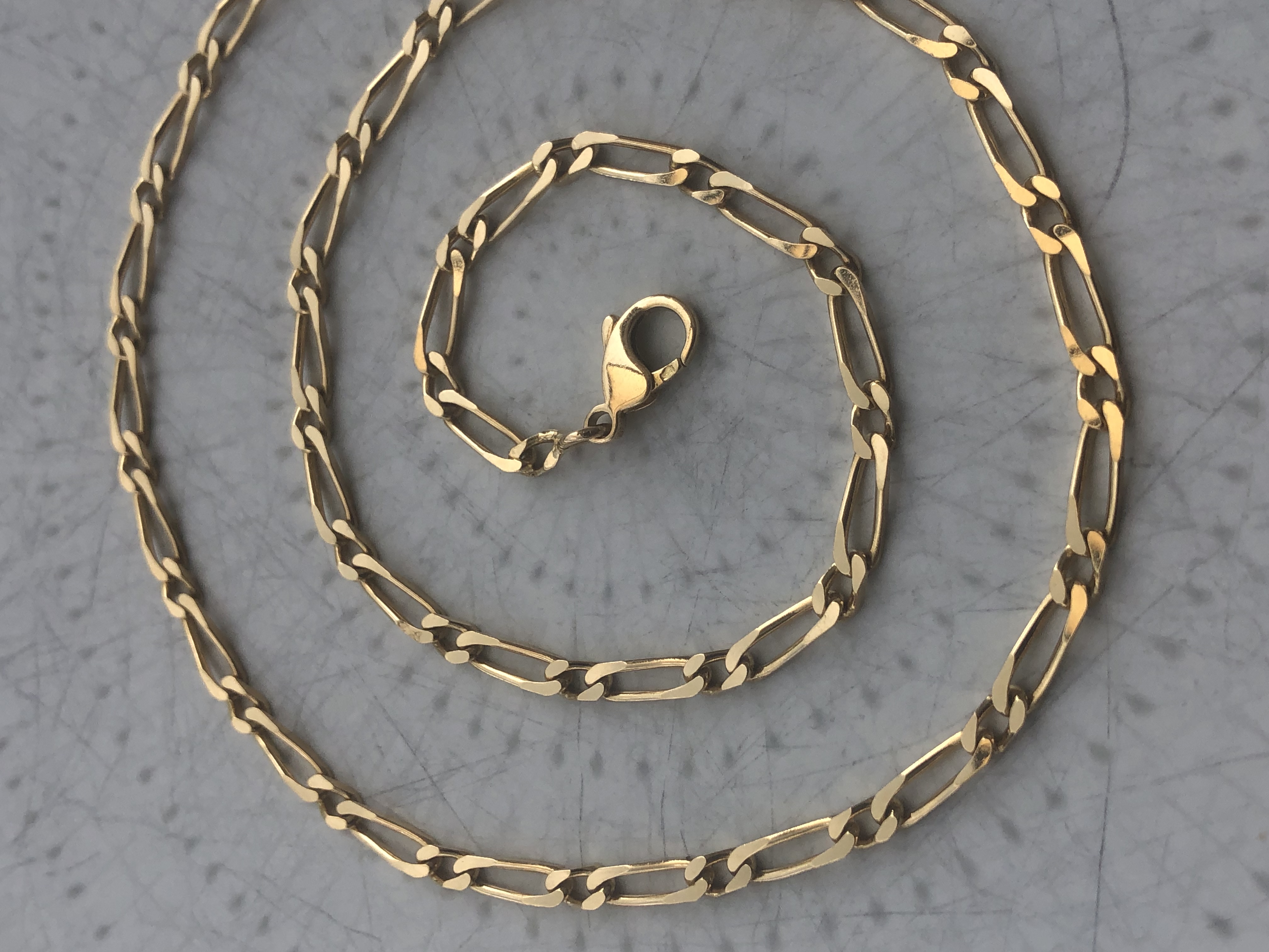 Chaine figaro en or 18 carats 
