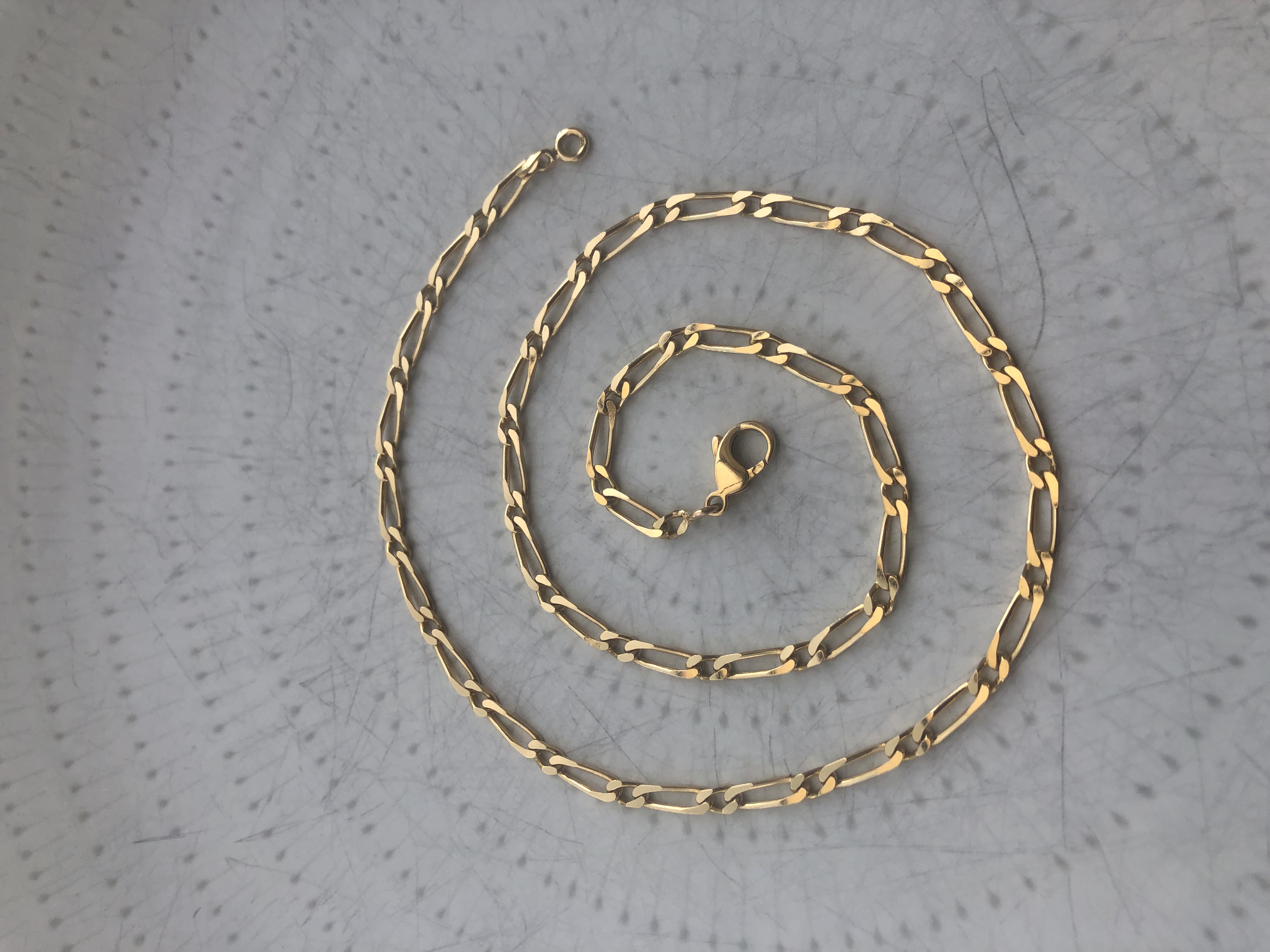 Chaine figaro en or 18 carats 