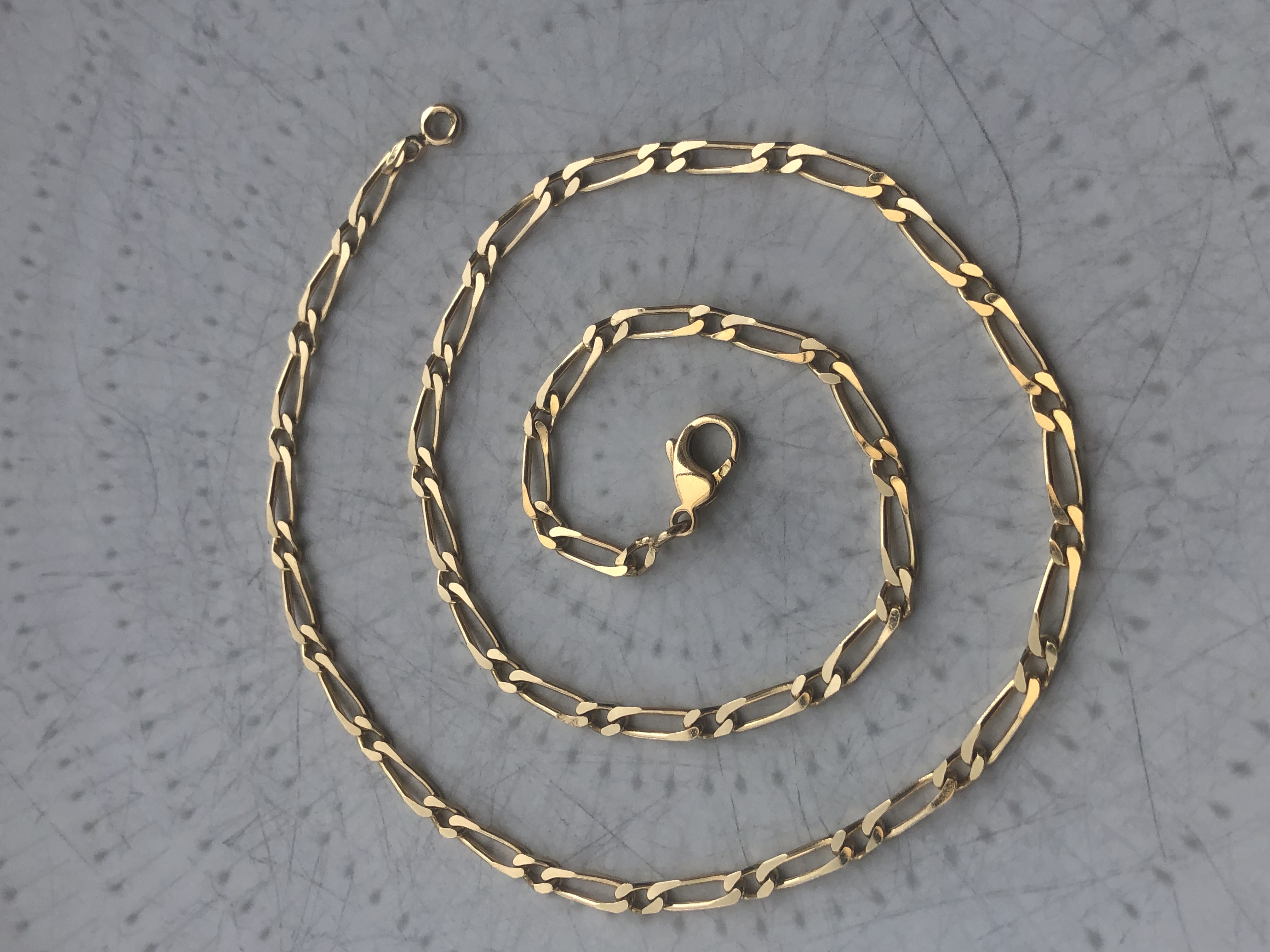 Chaine figaro en or 18 carats 