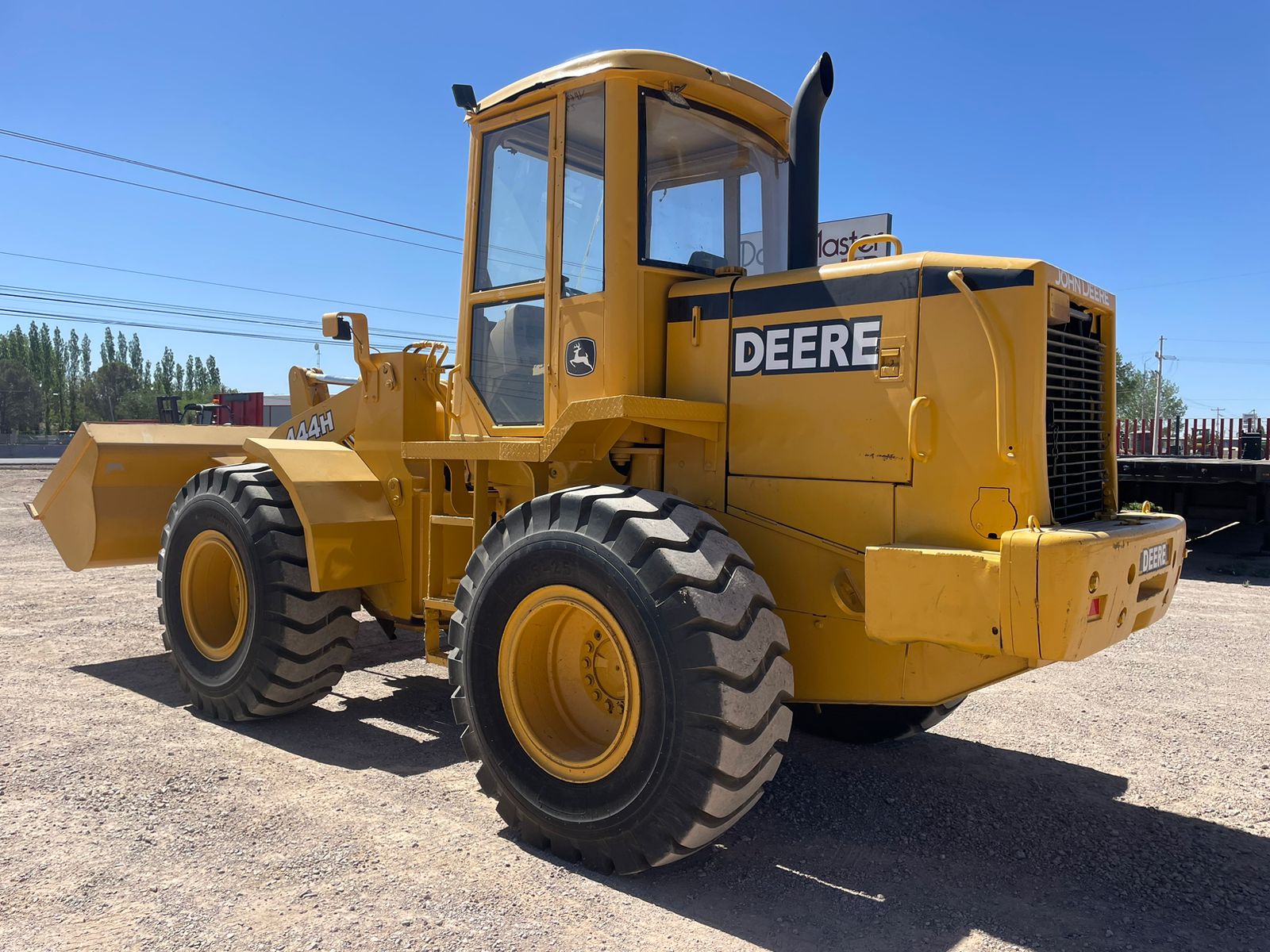 #1487-1 Cargador frontal John Deere 444H 1999