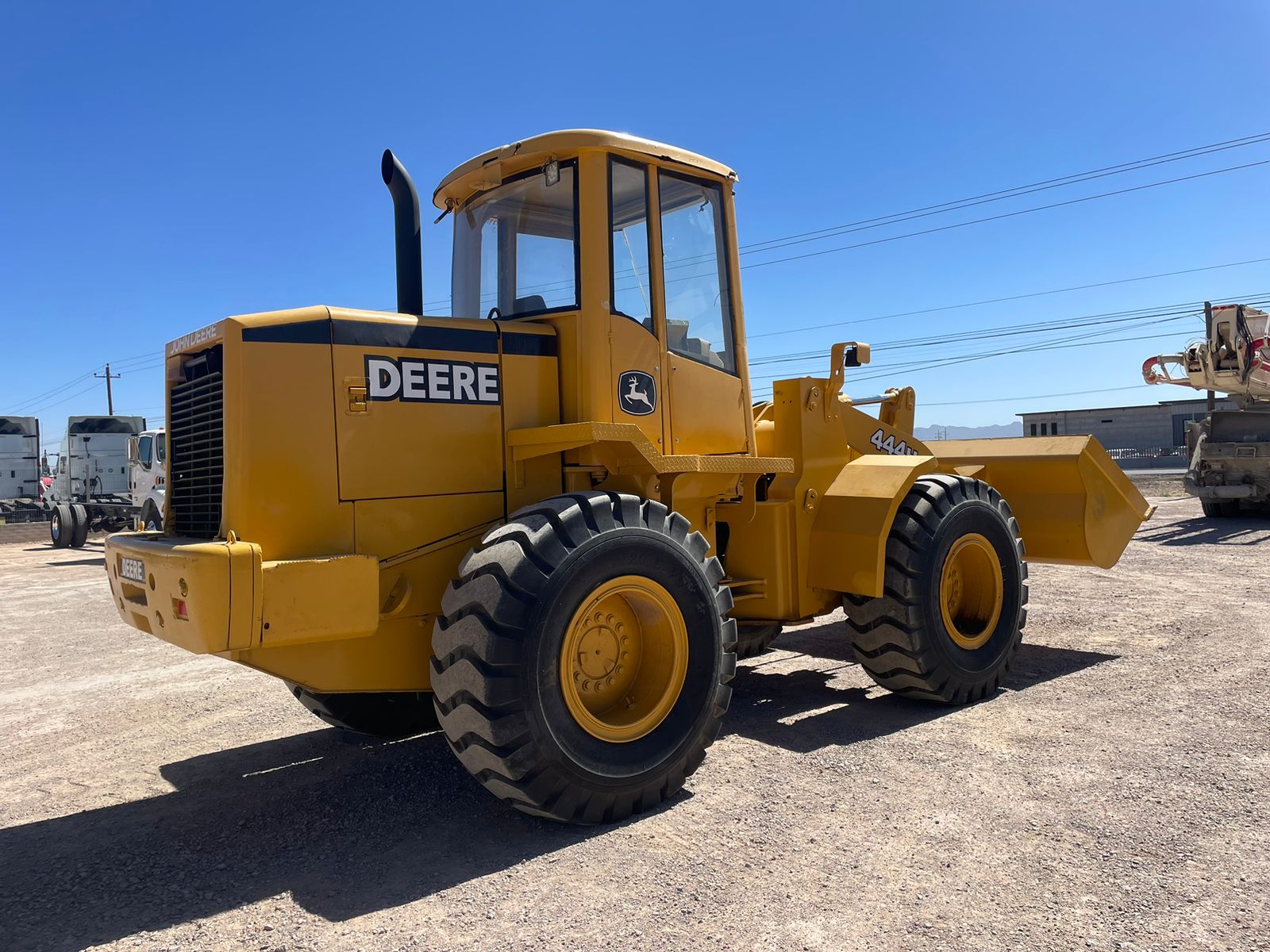 #1487-1 Cargador frontal John Deere 444H 1999