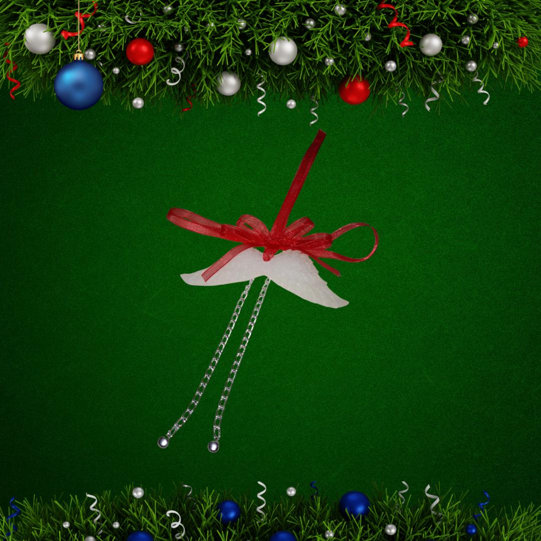 Vela navideño con forma de alas de ángel