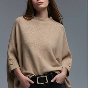 Le pull avec détail boutons