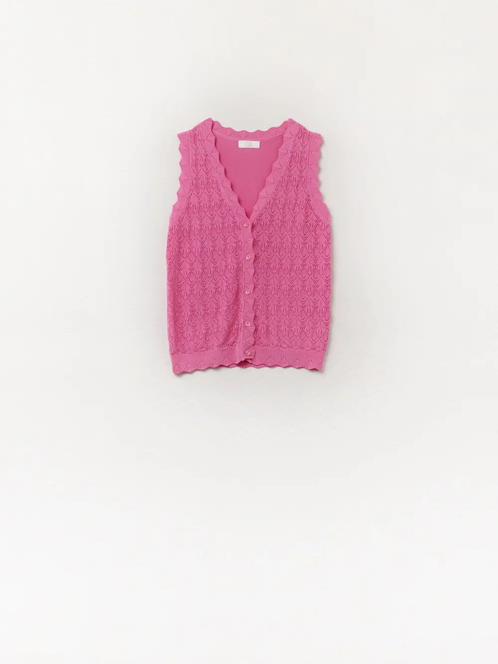 Le gilet en maille pointelle