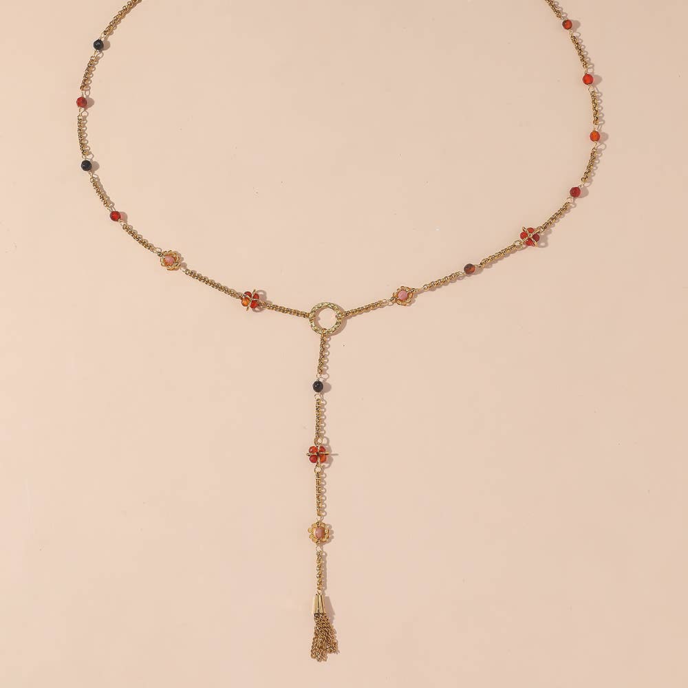 Collier chaîne doré et perles rouges forme Y