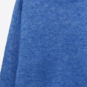 Le pull avec dentelle au col et au poignet