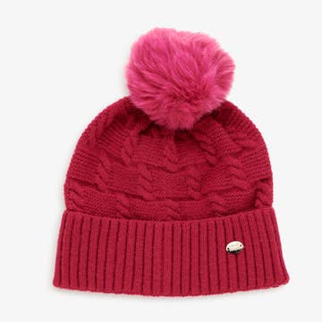 Bonnet rouge avec le pompon rose