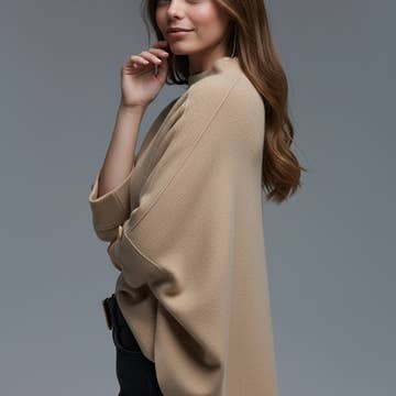 Le pull avec détail boutons