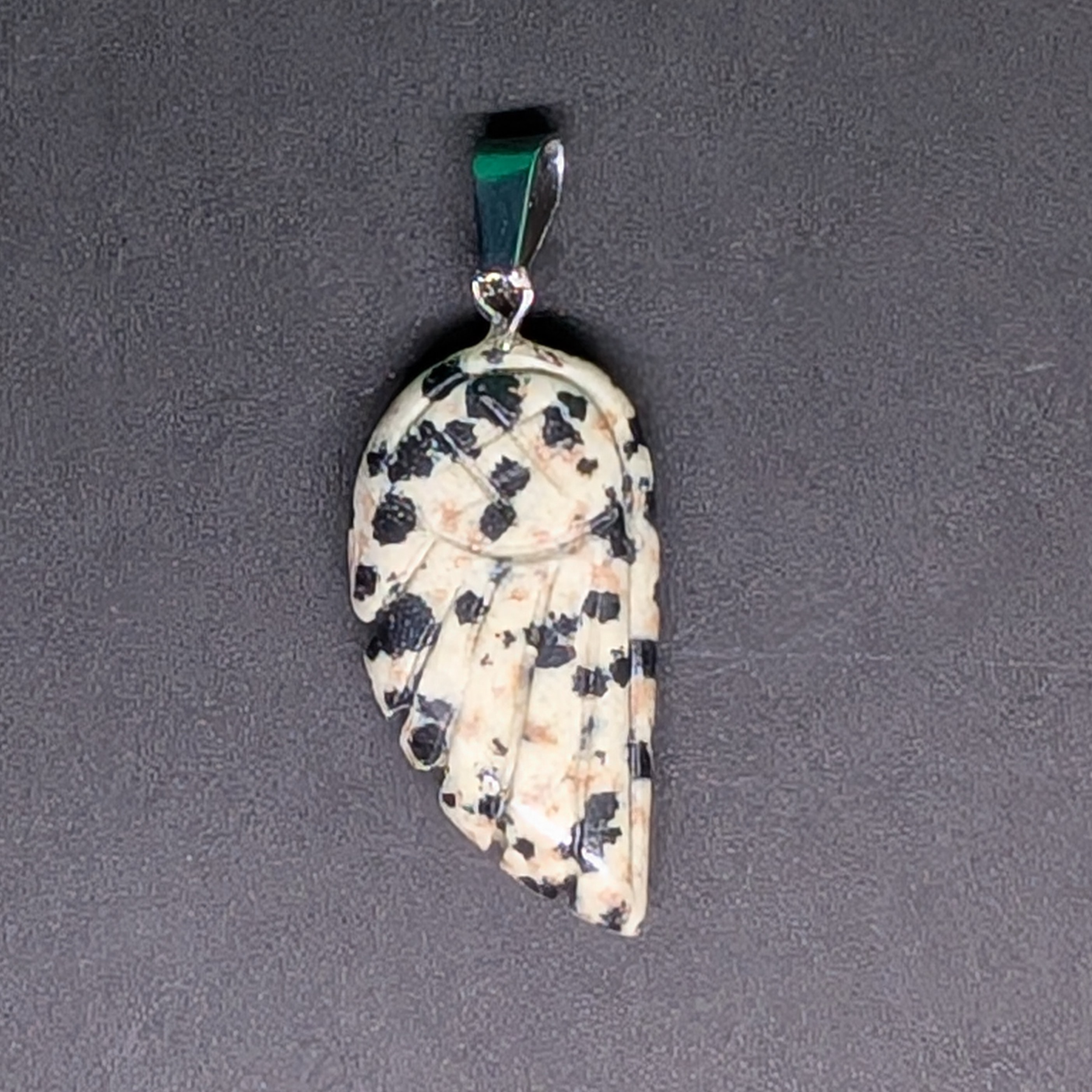 Hand-Carved Wing Pendant Dalmatian Stone
