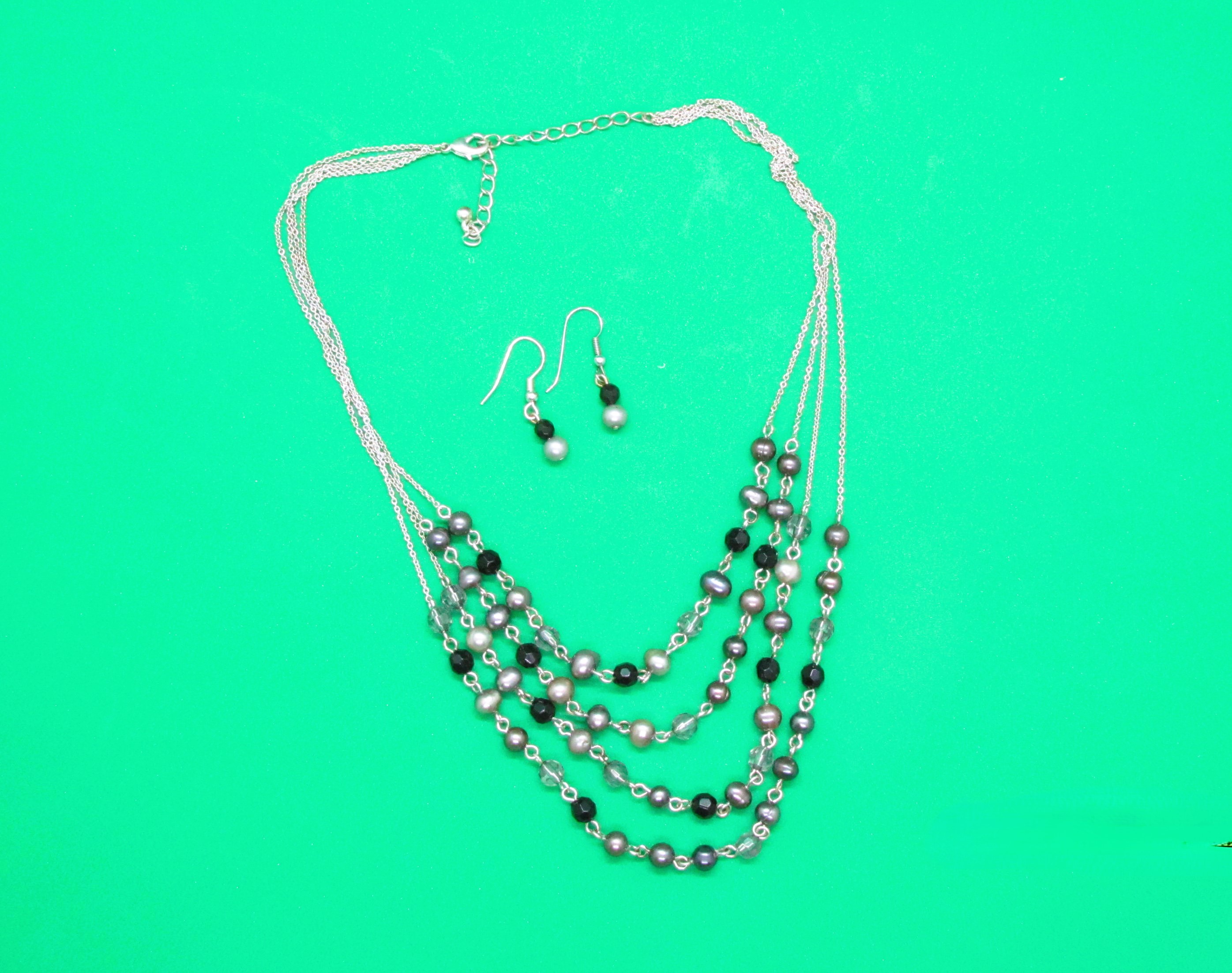 Four Strand Pearl Set.