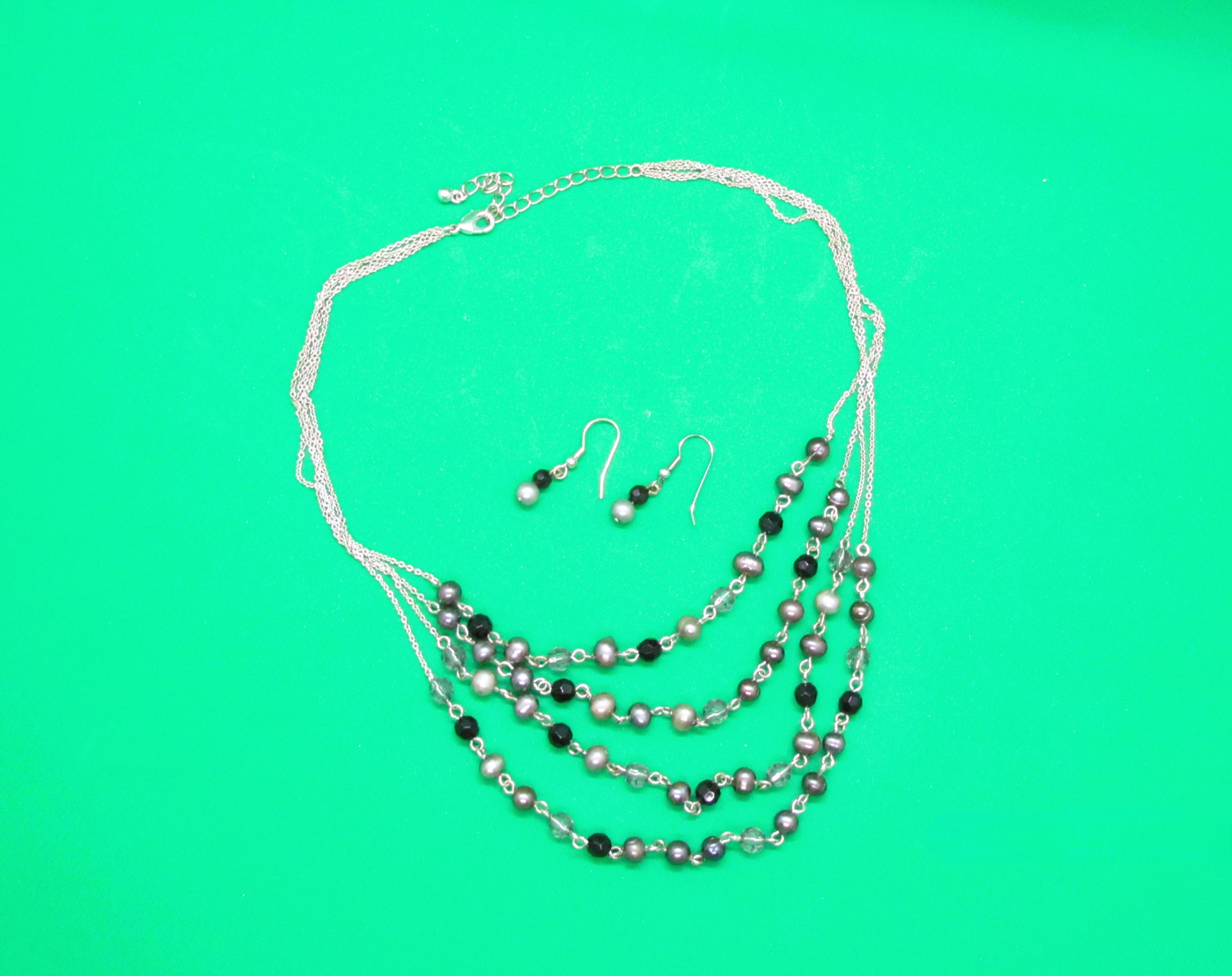 Four Strand Pearl Set.