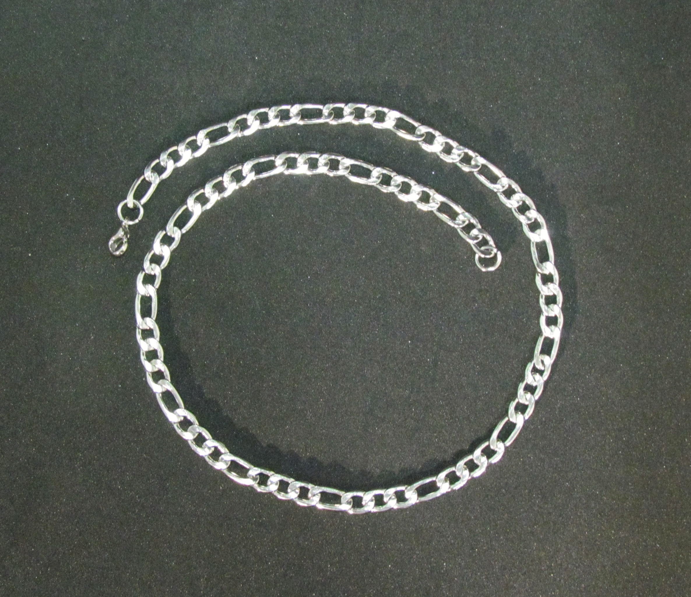 The Versatile Figaro Chain in anti tarnish Stainless Steel. 