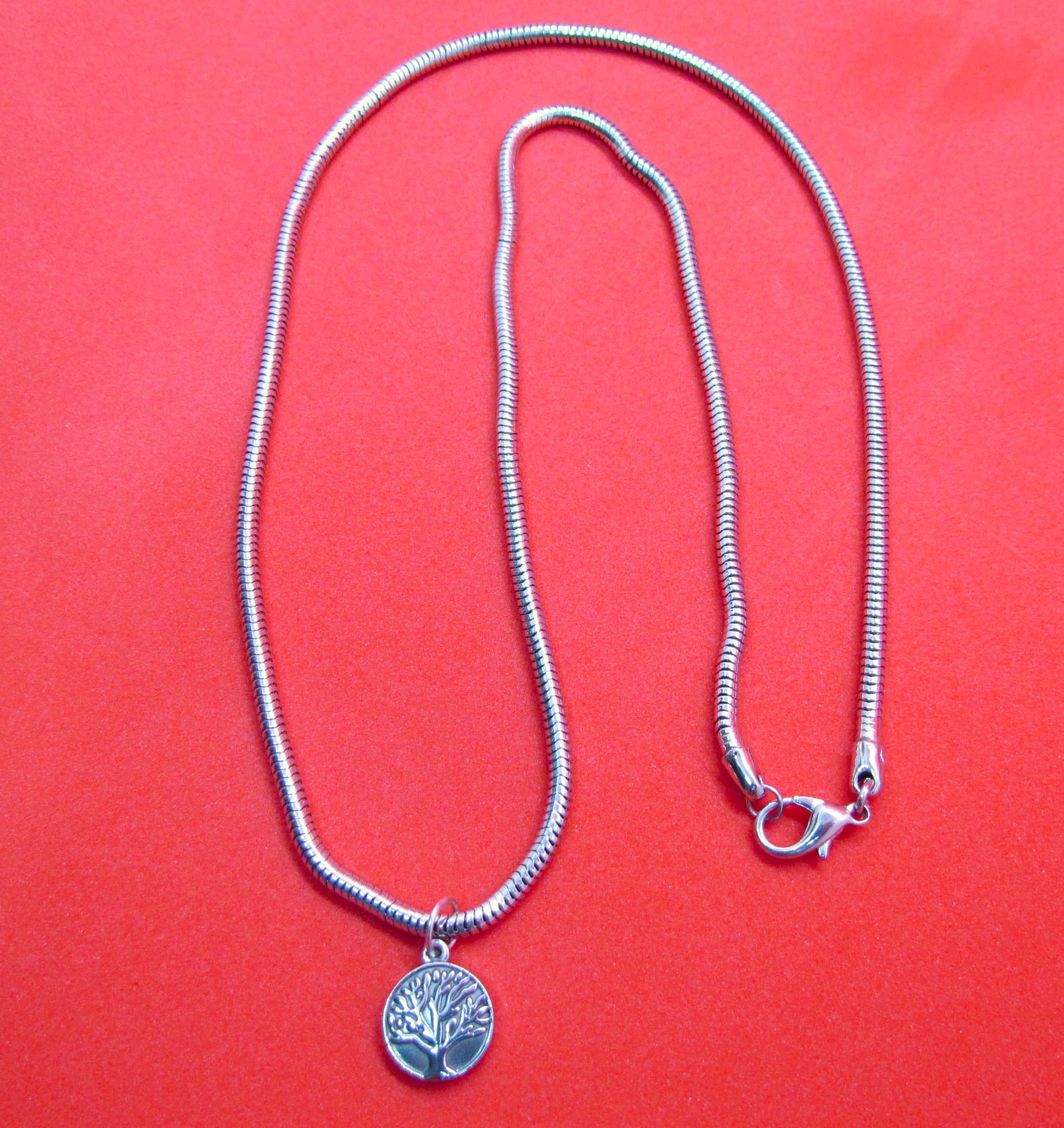 Roots of Strength: Tree of Life Stainless Steel Pendant.