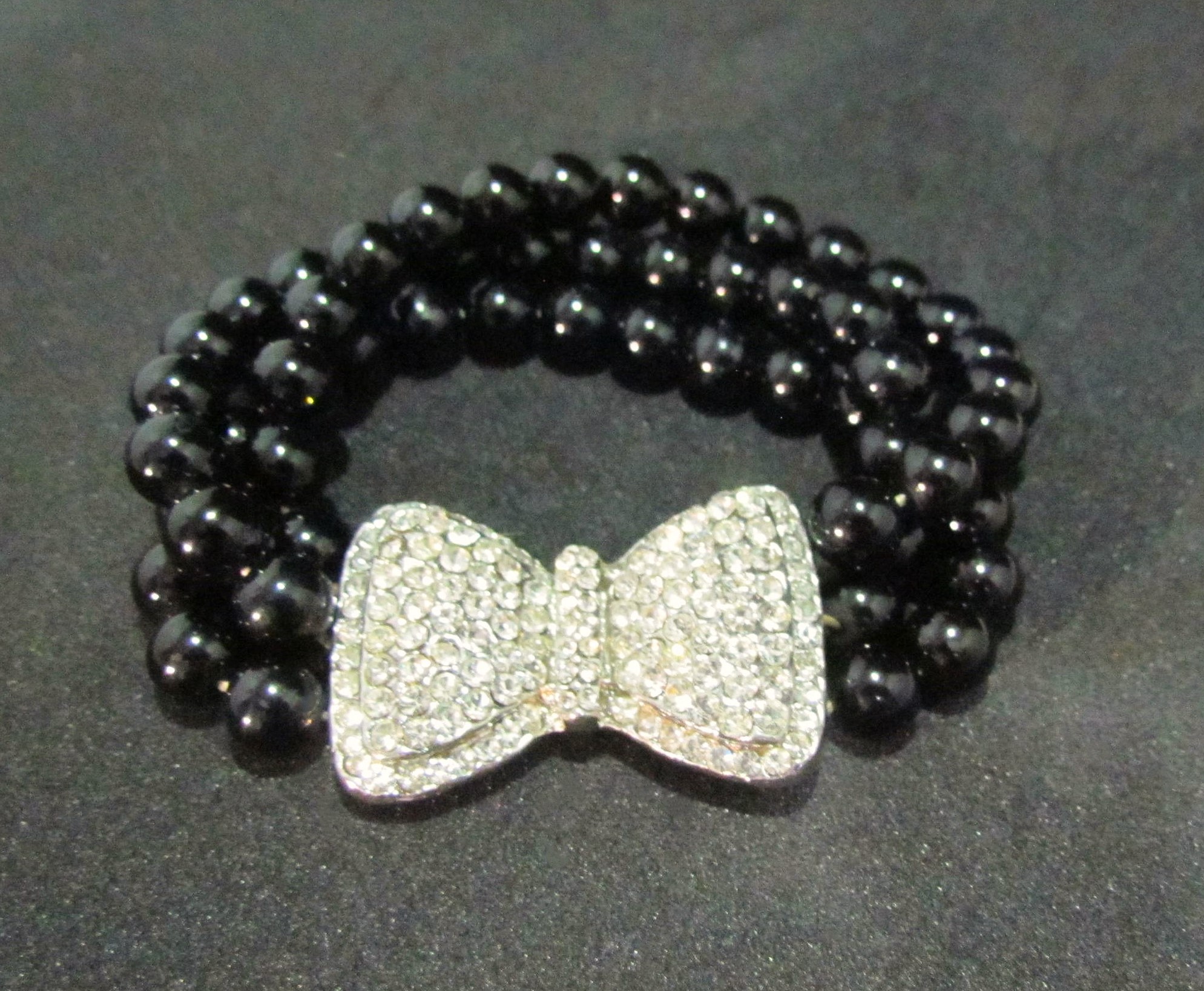 Rhinestone Bow on Black Bracelet.