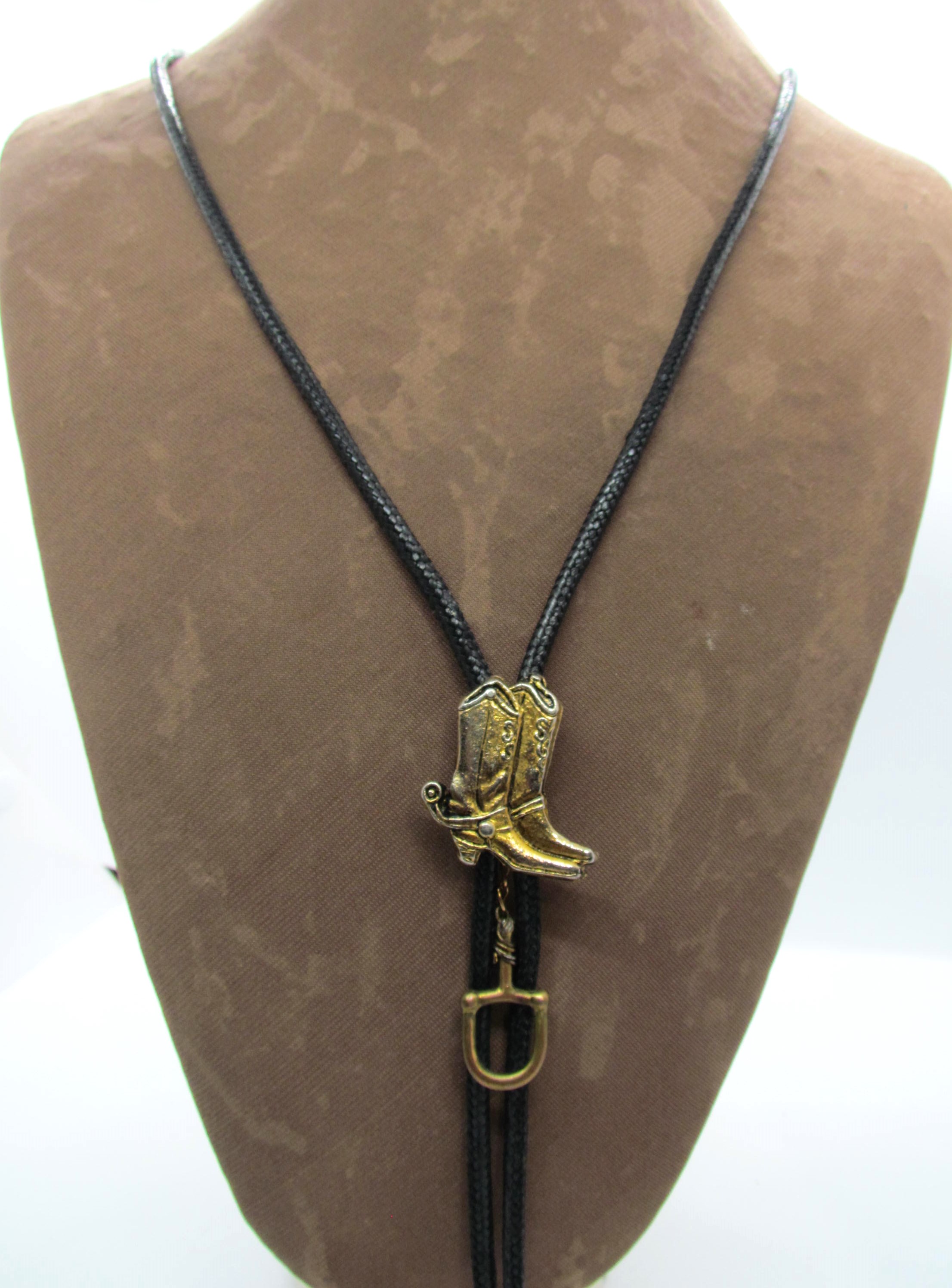 Handcrafted Cowboy Boots & Stirrup Leather Bola Tie.