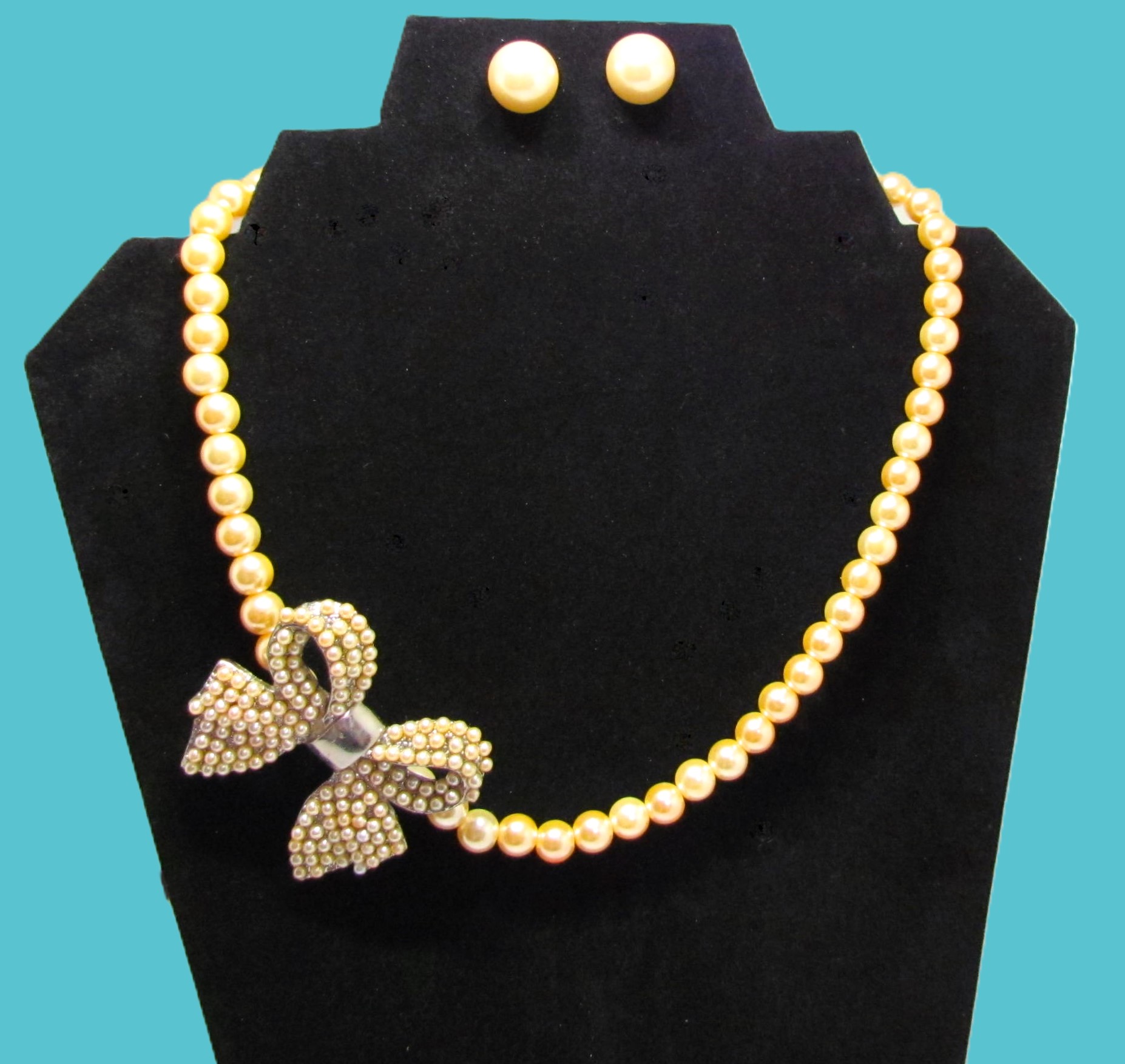 Artisan Gold Pearl Side Pendant Bow Necklace Set.