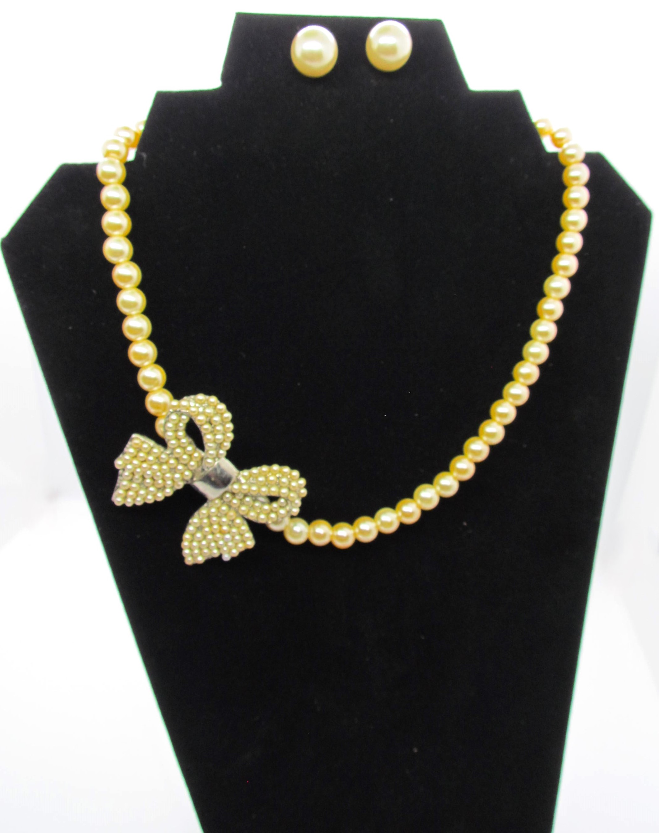 Artisan Gold Pearl Side Pendant Bow Necklace Set.