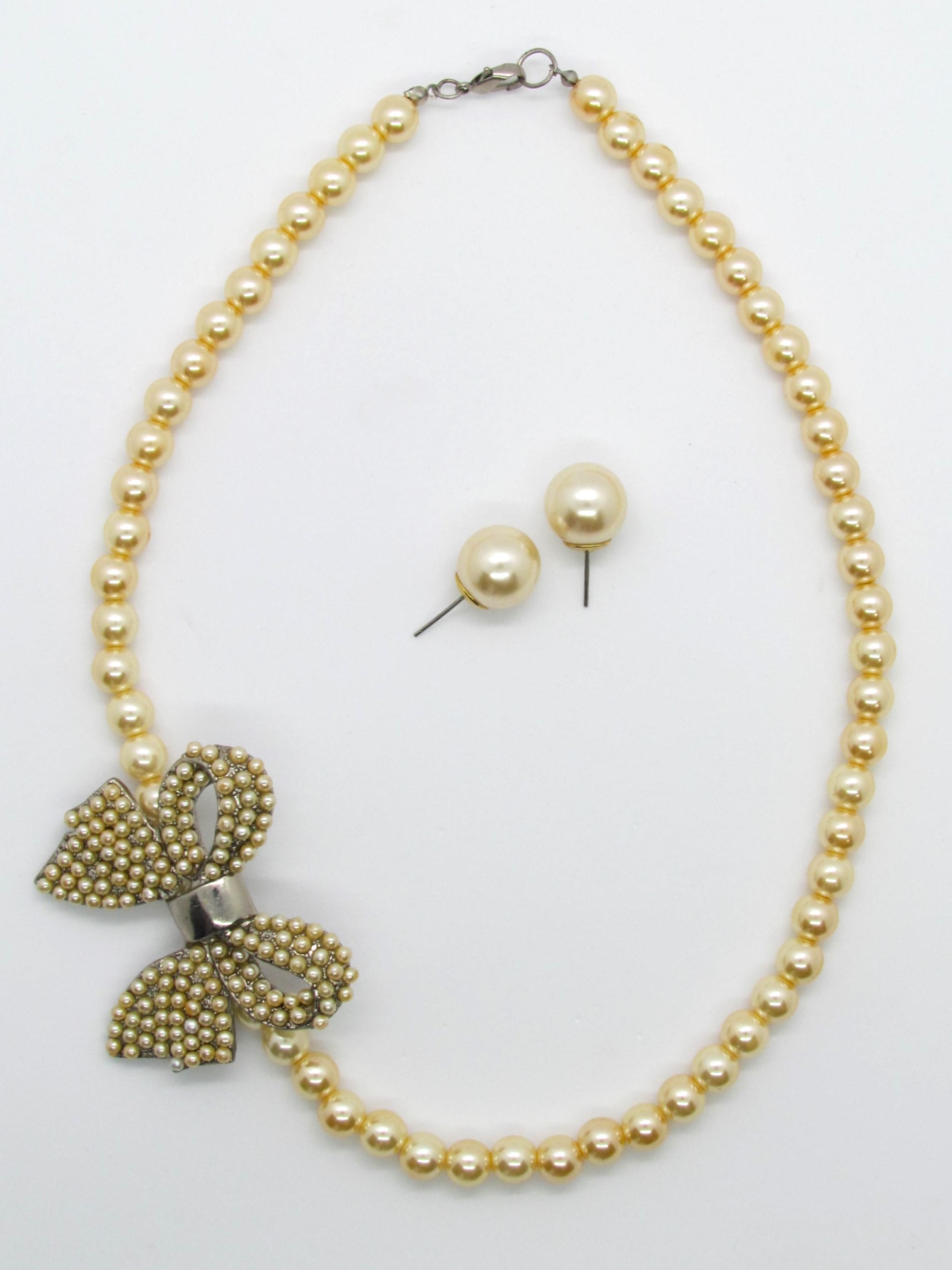 Artisan Gold Pearl Side Pendant Bow Necklace Set.
