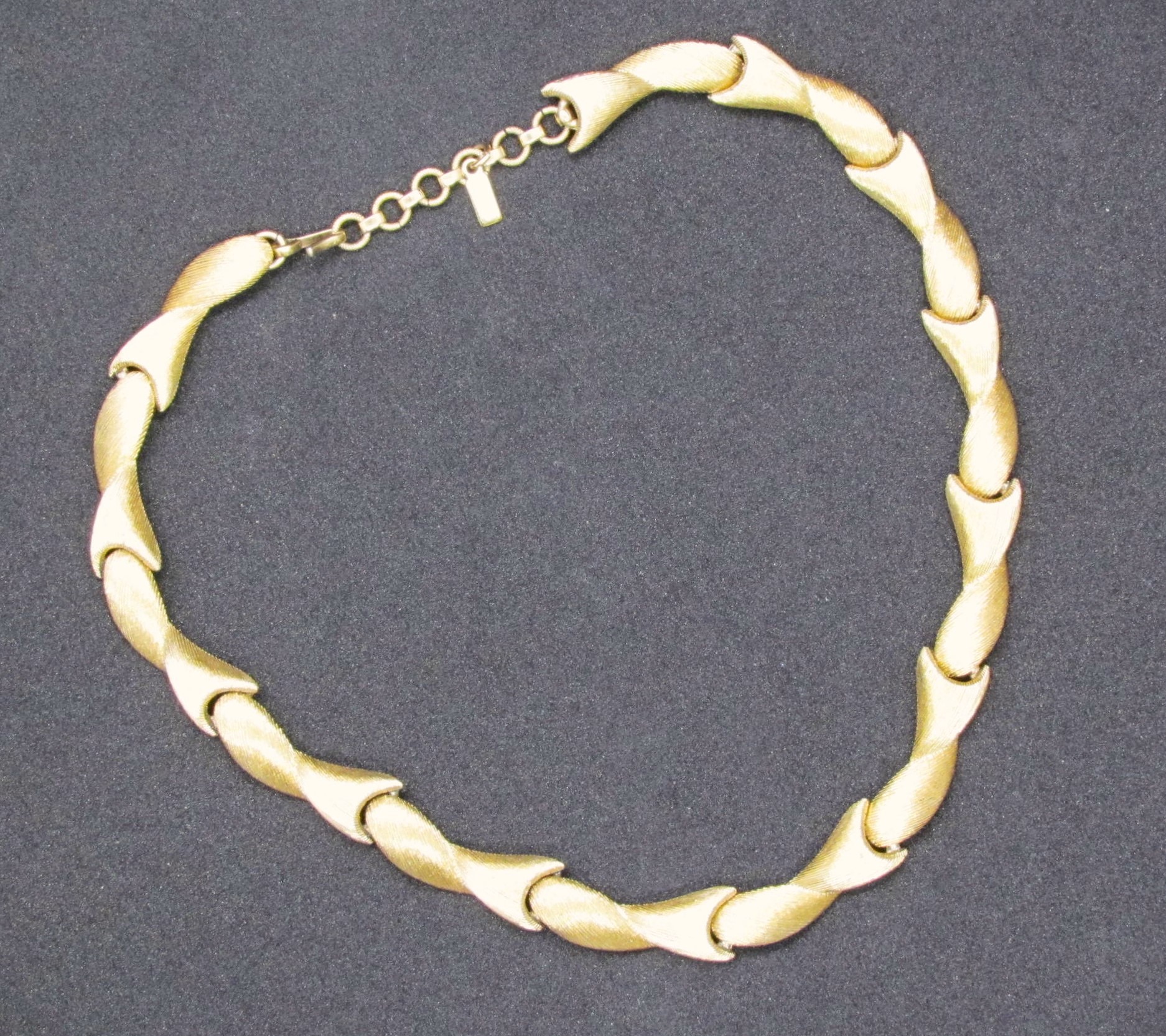 Monet Signed Gold Tone Sectional Choker Necklace.