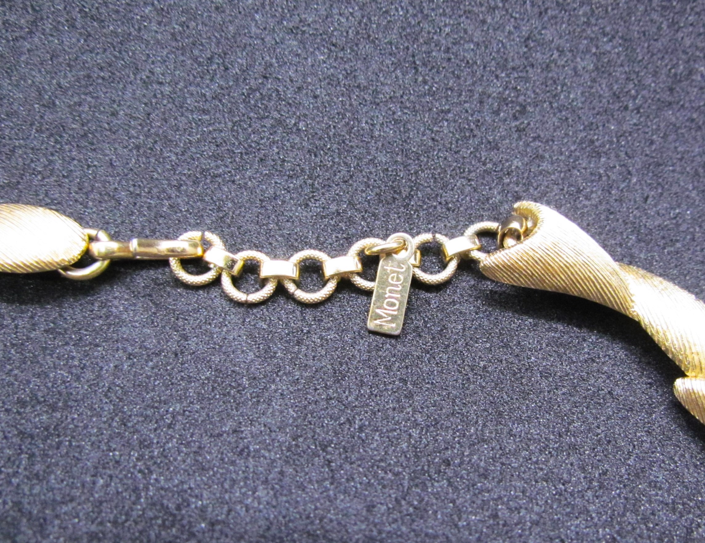 Monet Signed Gold Tone Sectional Choker Necklace.
