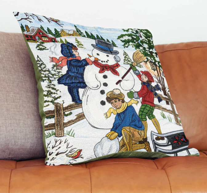 Kussenhoes met geborduurde kerstafbeelding.