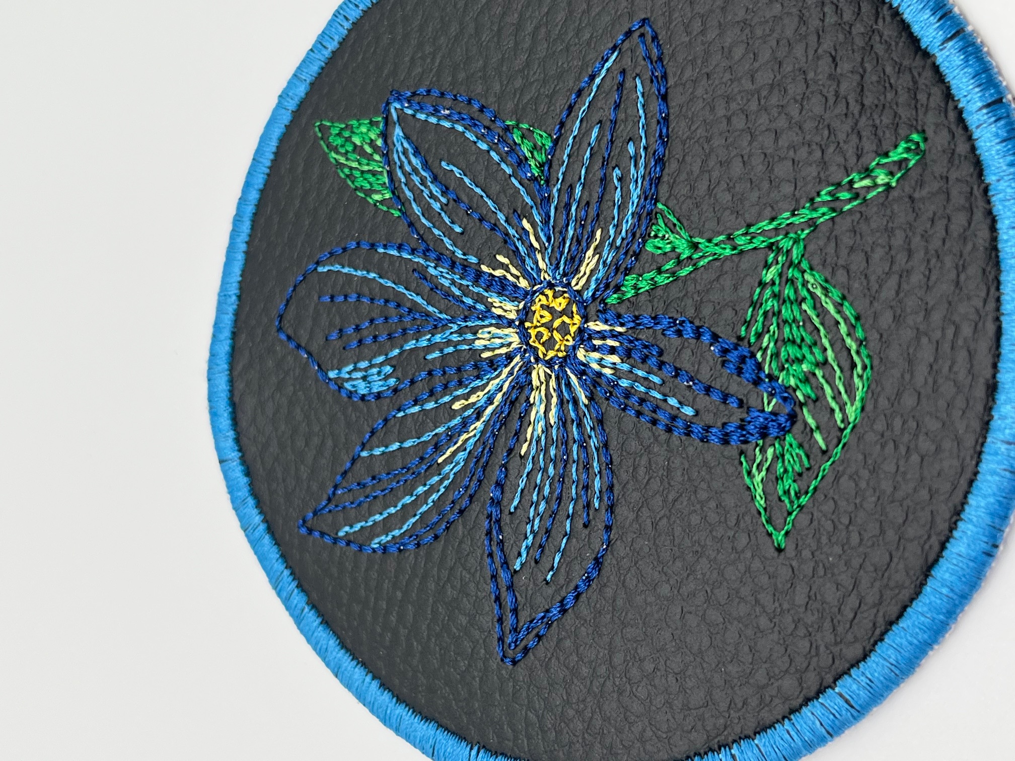 Geborduurde Onderzetter Bloem Blauw, set van 4