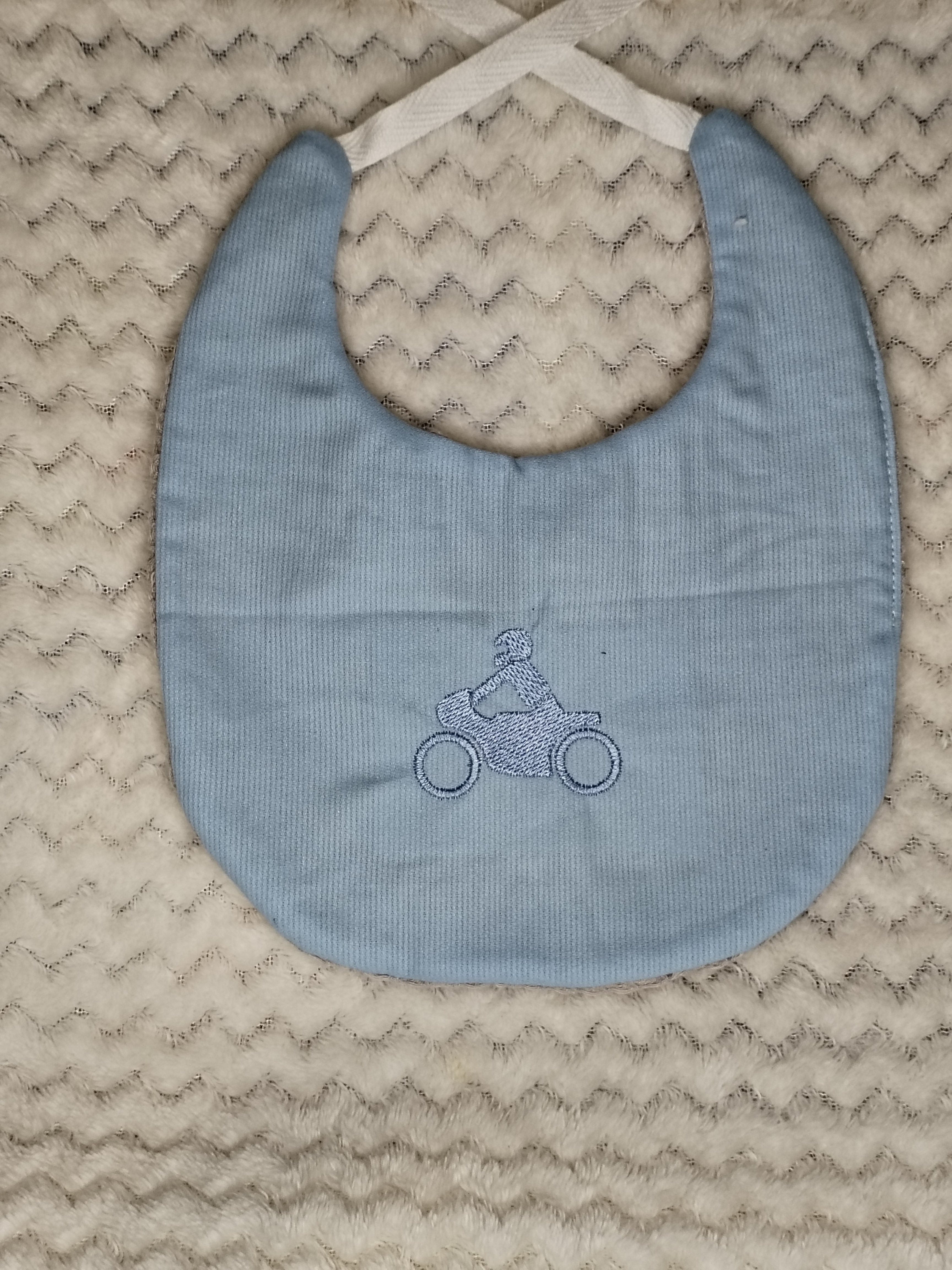 Bavoir moto bleu clair