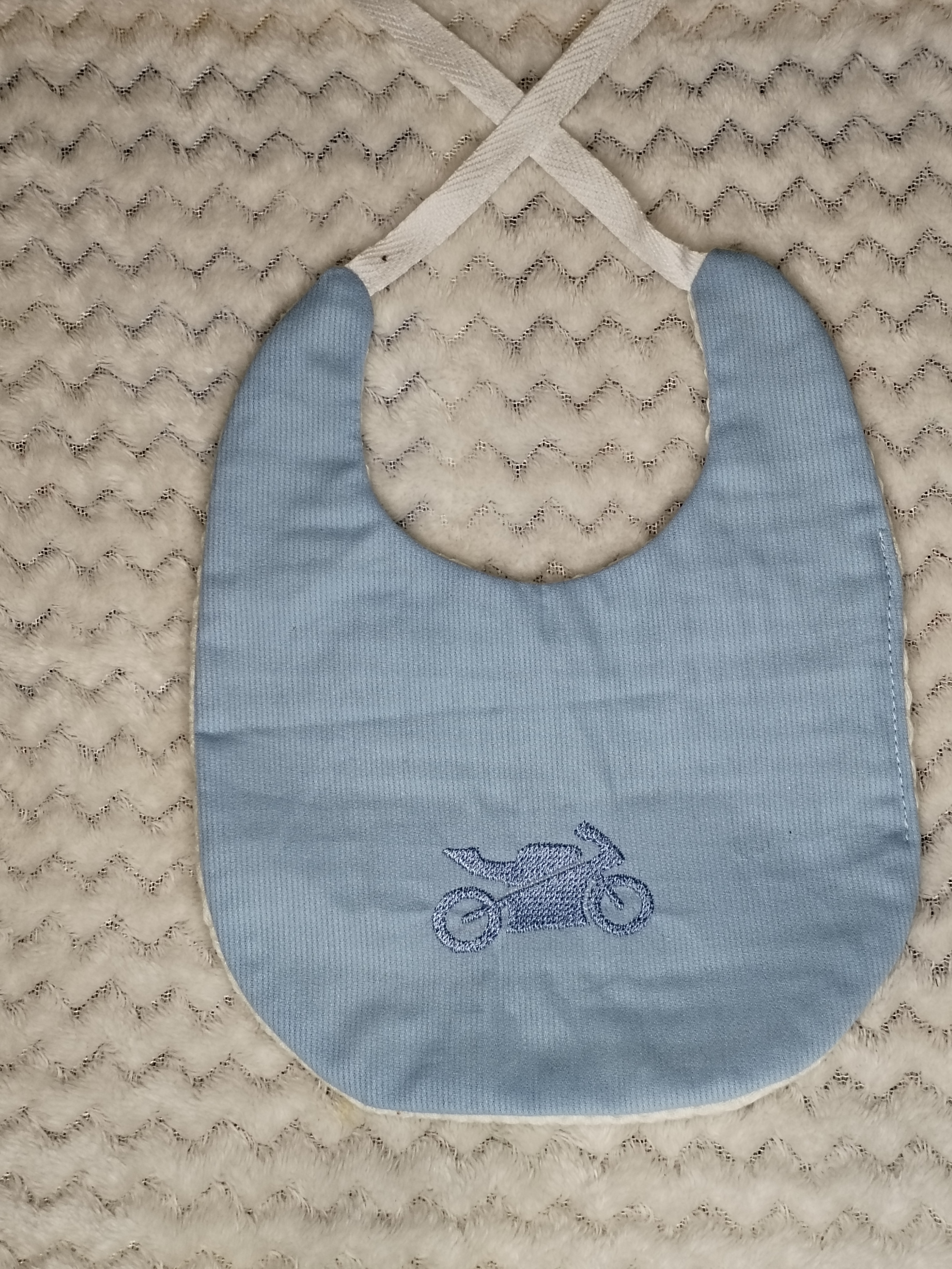Bavoir moto bleu clair