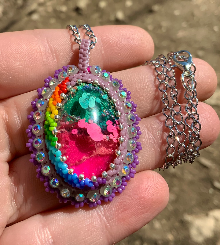 Purple rainbow glow in the dark beaded pendant