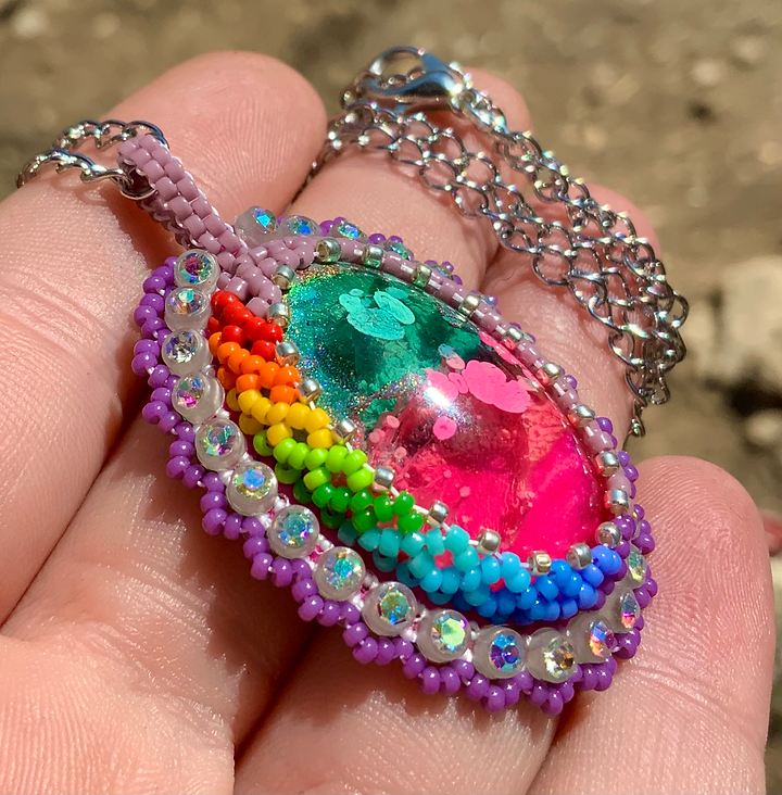 Purple rainbow glow in the dark beaded pendant