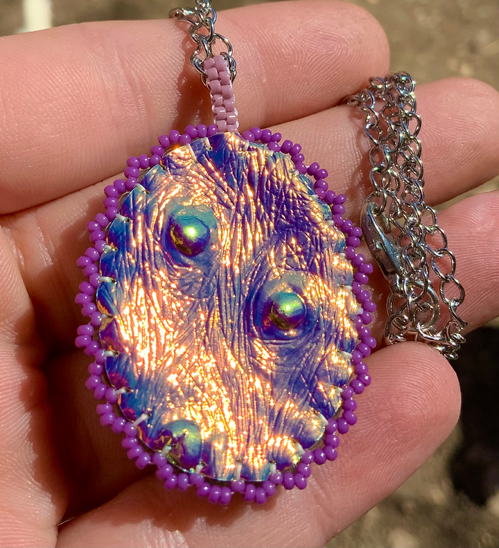 Purple rainbow glow in the dark beaded pendant