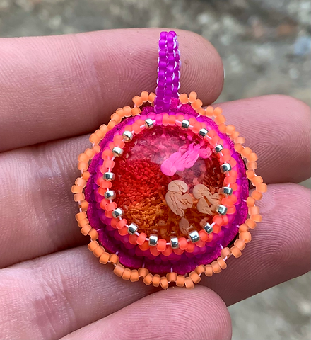 Fire flow beaded pendant