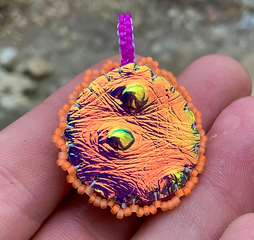 Fire flow beaded pendant