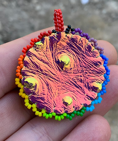 Bright side of the moon beaded pendant