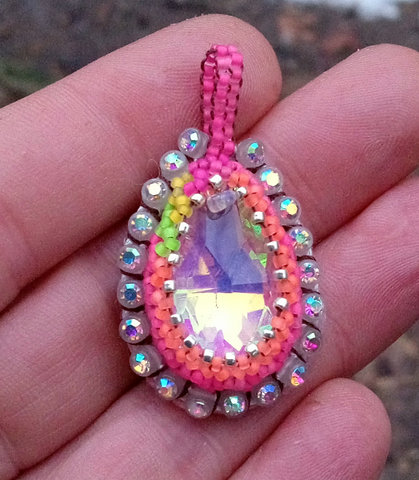 Blacklight reactive sparkly beaded pendant