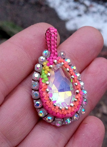 Blacklight reactive sparkly beaded pendant