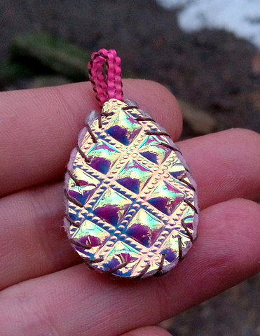 Blacklight reactive sparkly beaded pendant