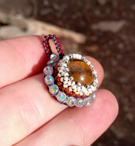 Glow in the dark beaded tigers eye pendant