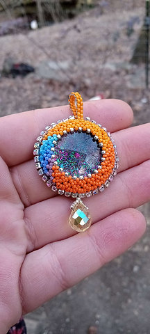 Orange swirl beaded pendant