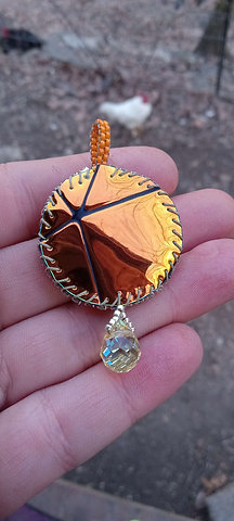 Orange swirl beaded pendant