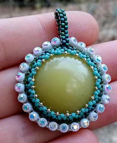 Glow baby beaded pendant