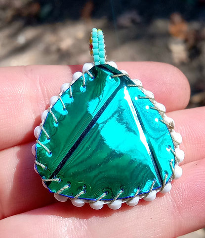 Orange and teal beaded pendant