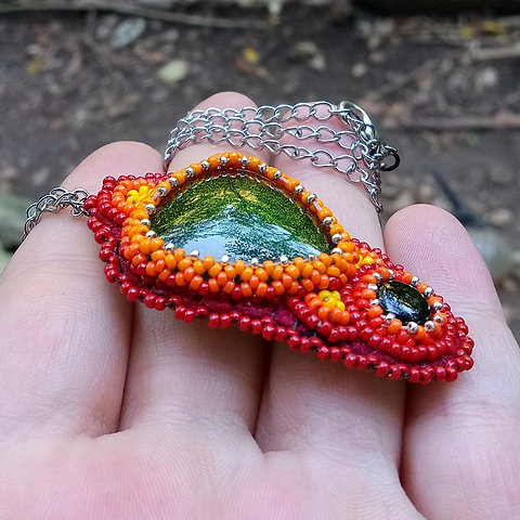 Firey bead embroidered glass and onyx pendant