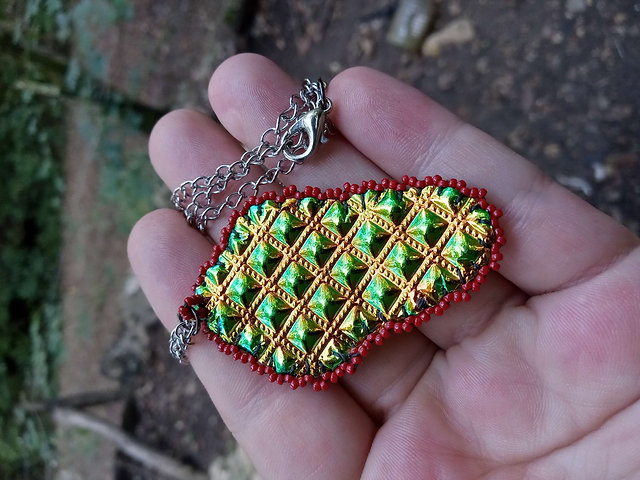 Firey bead embroidered glass and onyx pendant