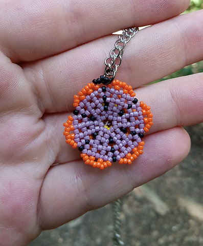 Purple and orange beaded flower pendant with amethyst