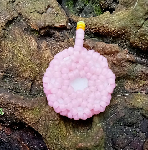 Pink eyeball with pink and yellow beadwork