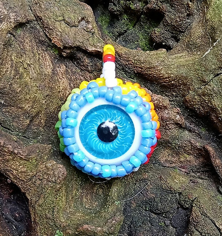 Blue eyeball with rainbow beadwork